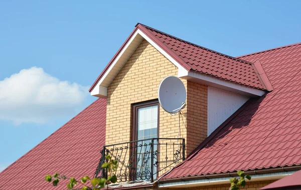 Attic house roofing construction with metal roof and metal balcony — Stock Photo, Image