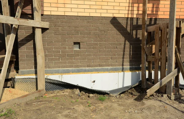 Brick house foundation waterproofing problem during house constuction.