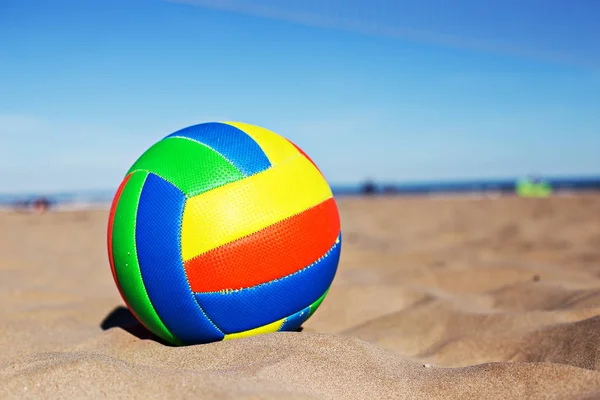 Beach Volleyball. Game ball on sand waiting for game. At the beach
