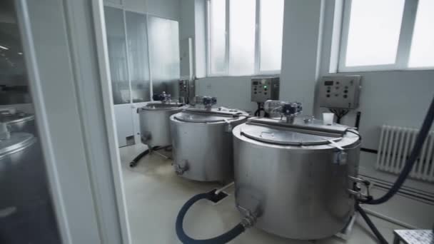 Dairy factory equipment. Special tanks with milk located in premises — Stock Video