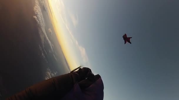 RAVENNA, ITALY - JUNE 23, 2015: Team of skydivers free falling in sky. Height. Extreme activity. Sunset. Speed — Stock Video