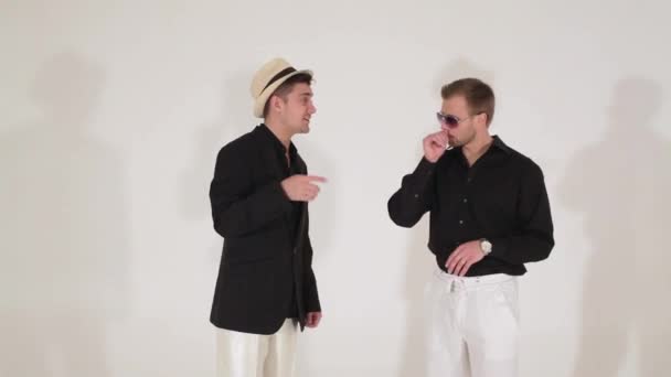 Dancing rehearsal of cute men in hat and black suits with white pants on camera — Stock Video