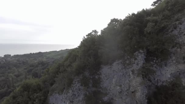 Drone camera catches green hill with cave , Black Sea, Abkhazian shorecost — Stock Video