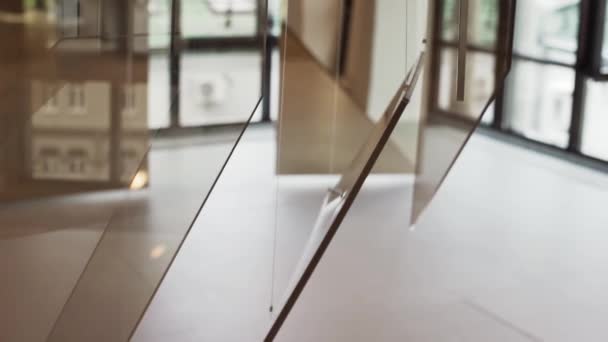 Brown glass installations hanging with white cords are presented at new hall. — Stock Footage Brown glass installations hanging with white cords are presented at new hall. Stock Video