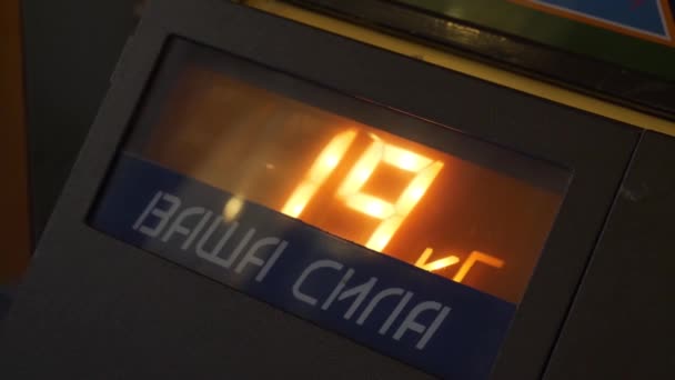 Metallic electronic box with flashing digits indicating on glass panel window. — Stock Video