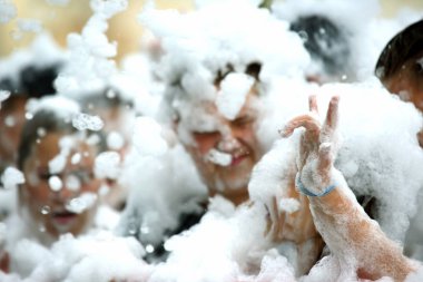 man in a soapy foam at the festival disco clipart