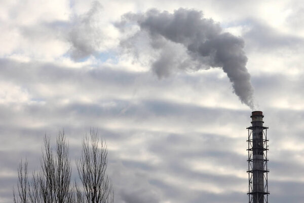the smoke from the chimney of an industrial enterprise in the sky