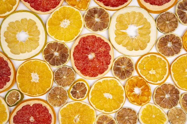 Torkade Skivor Olika Citrusfrukter Vit Bakgrund — Stockfoto