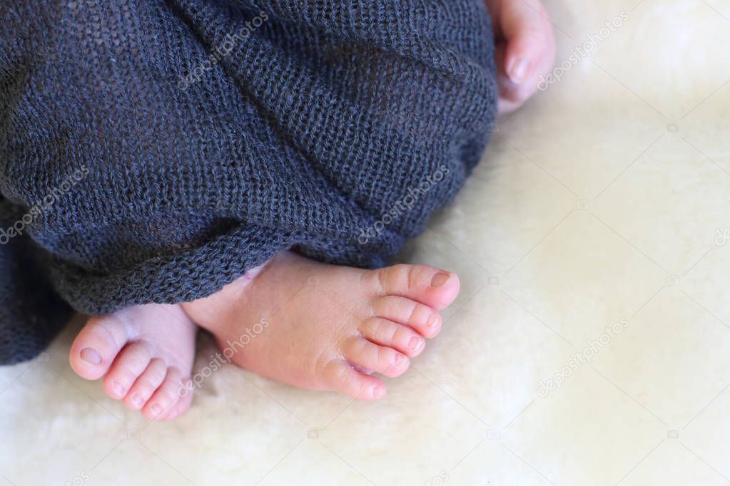 feet of a sleeping newborn baby close-up