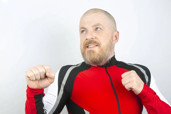 cheerful bearded man with his hands up