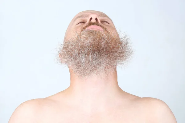 Bearded man on a light background — Stock Photo, Image