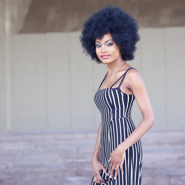 Fashionable and beautiful African girl in striped clothes posing — Stock Photo, Image