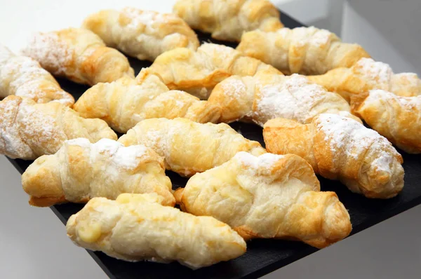 Delicious baked croissants on the table — Stock Photo, Image