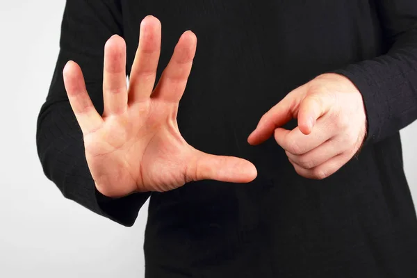 man shows different hand gestures