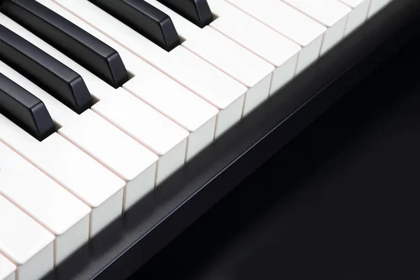 Клавіші піаніно крупним планом на темному фоні — стокове фото