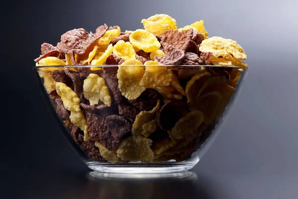 colored corn flakes in a bowl. snack food for Breakfas