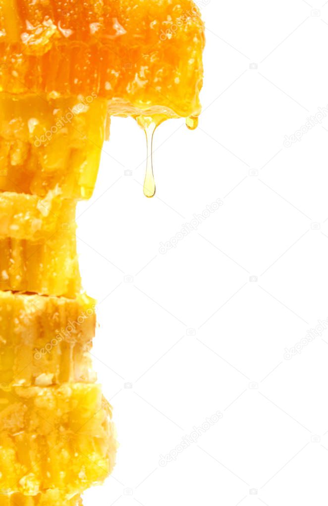 honey flowing from the honeycombs on a light background