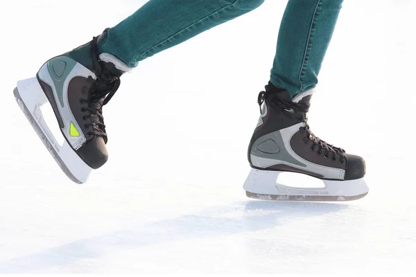 Feet skating on the ice rink . Hobbies and recreation. Sports an