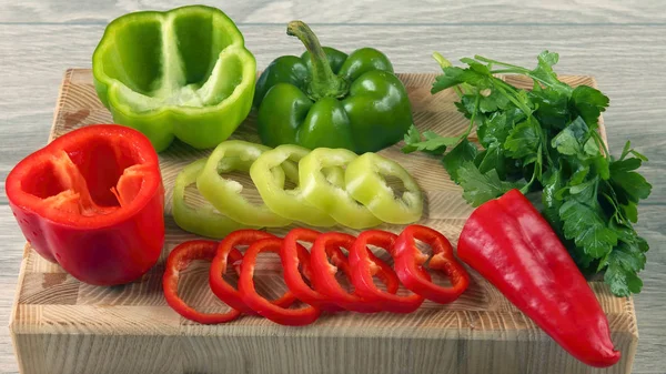 cut sweet pepper on wooden board. raw health food