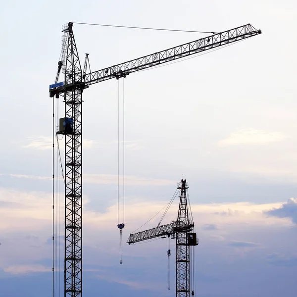 construction crane on the background of the evening sky.