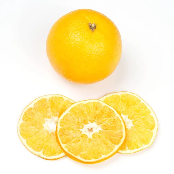 Fresh orange and pieces of dried orange on white background — Stock Photo, Image