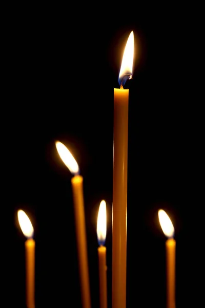 Burning in the dark taper candles. the fire burning in the darkn — Stock Photo, Image