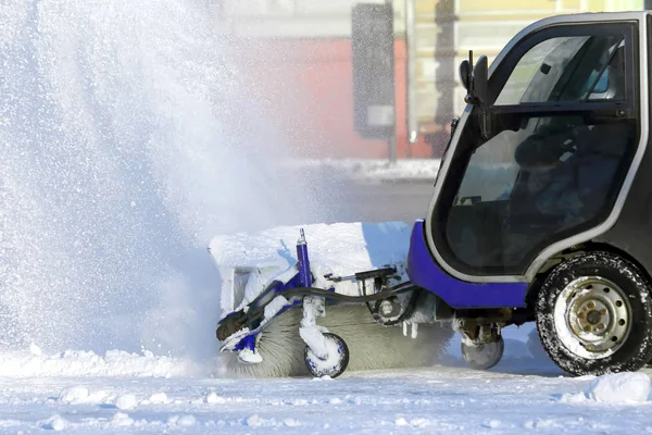 street cleaning the city from snow with the help of special mach