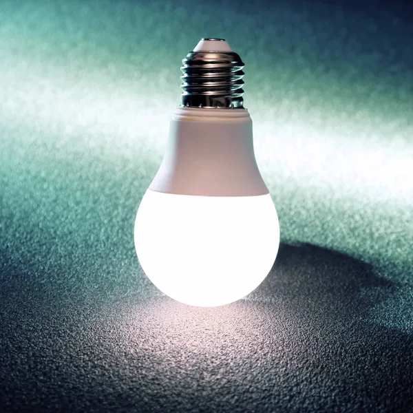 Modern led lamp is turned on a dark background Royalty Free Stock Images