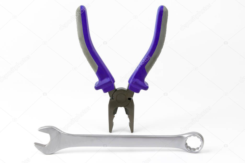wrench and pliers with blue and grey handles on white background