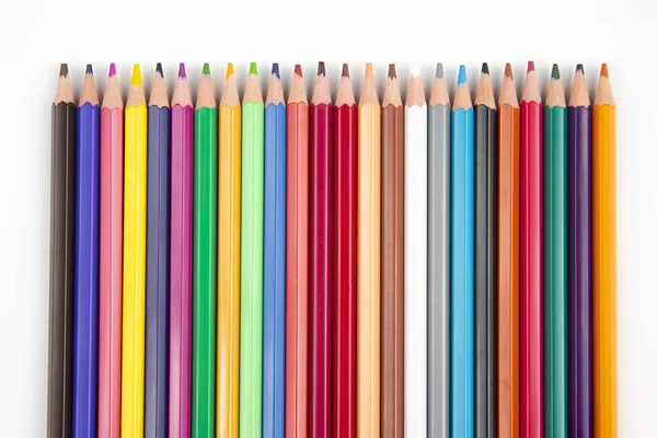 Colored pencils for drawing on a white background. Education and — Stock Photo, Image