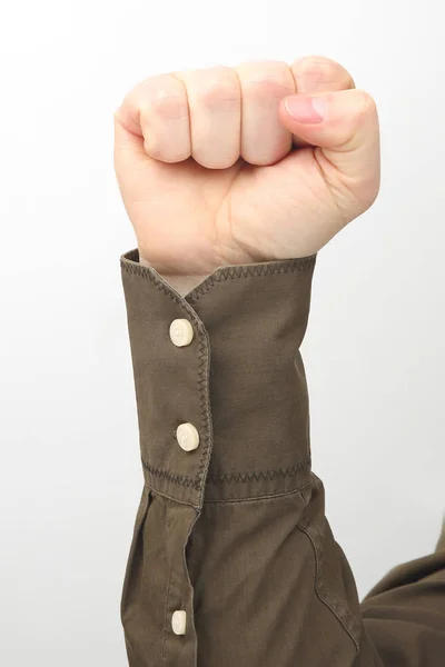 Male hand clenched in a fist on a white background — Stock Photo, Image