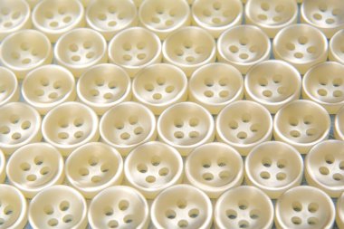 Giysiler için plastik düğmeler. Geçmişi ve dokusu. Moda ve giysi. Fabrika endüstrisi.