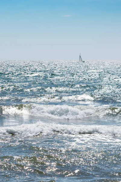 Summer storm in sunny day. Waves, sail, sea