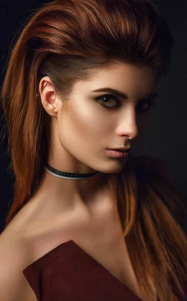 Close-up portrait of brunette woman with paper choker