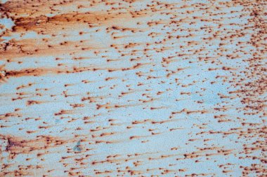 Eski metal yüzeyin arka plan ve dokusu mavi boya ve pas ile kaplıdır.