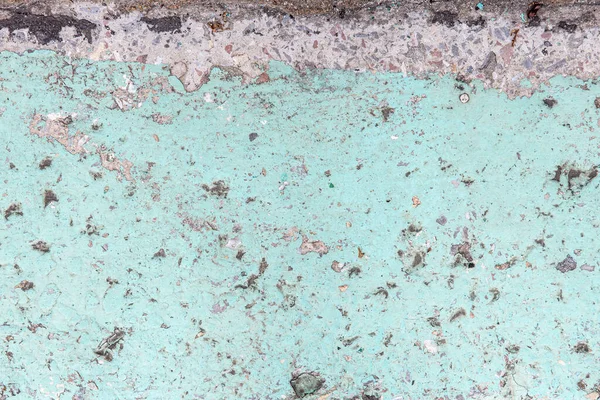 Superfície de concreto coberto com tinta rachada sob a influência do tempo — Fotografia de Stock