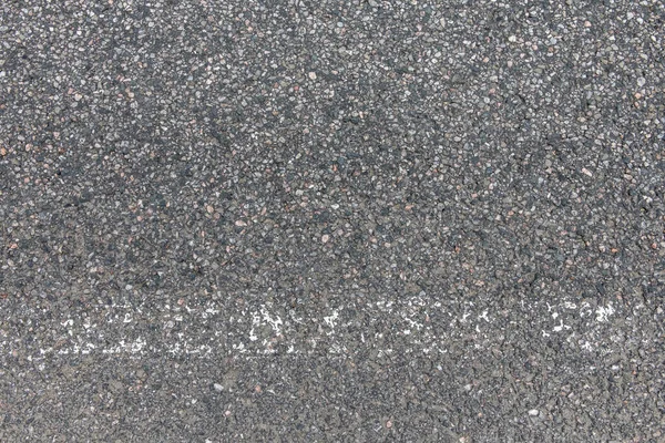 Pozadí a textura hrubě zrnité asfaltové cesty — Stock fotografie