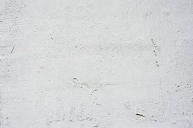 Arka plan gri bir sıva ile kaplı ve boyalı dış, kaba dökme çimento ve beton duvar doku, dekoratif rustik kaplama