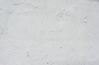 Arka plan gri bir sıva ile kaplı ve boyalı dış, kaba dökme çimento ve beton duvar doku, dekoratif rustik kaplama