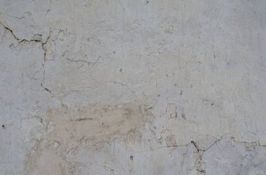Çatlak ve delikler ile çimento gri duvar dokusu 
