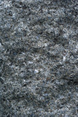 Doku kapanımlar, arka plan ile doğal koyu taş