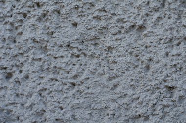 Arka plan gri bir sıva ile kaplı ve boyalı dış, kaba dökme çimento ve beton duvar doku, dekoratif kaplama 