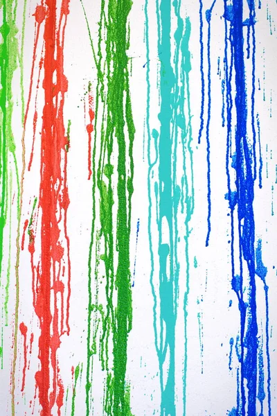 Muticolored streaks of paint leeking on white background, abstract painted stripes