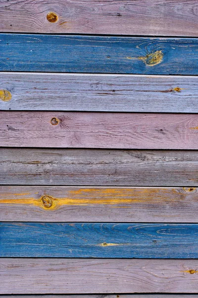 Rustic wooden fence texture background of natural brown and yellow colors