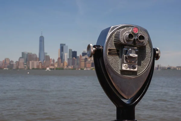 Vintage Coin-operated Binocular looking over Manhattan Skyline from Liberty Island