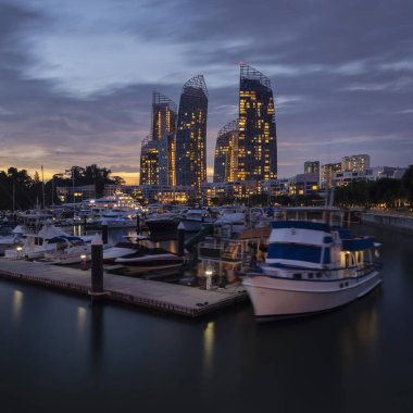 Keppel Bay Marina and Futuristic landmark of Singapore during Sunset clipart