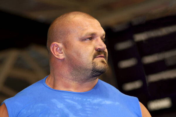 Brovary. Ukraine 29.12.2006 World's Strongest Man 2004 Vasyl Virastyuk. He is dressed in a blue T-shirt