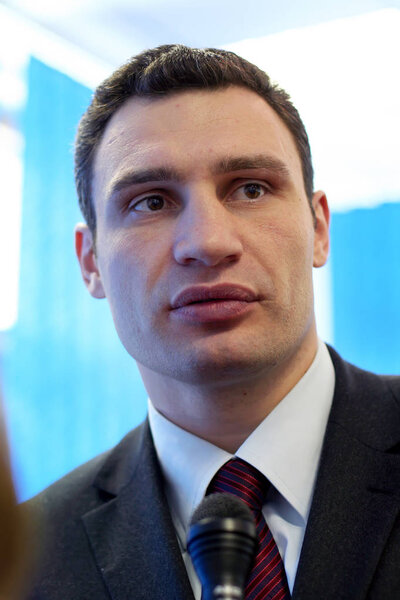 KIEV, UKRAINE - May 21, 2006: Ukrainian politician, boxer Vitali Klitschko in his office. He gives an interview before the election in fighting for the post of mayor of Kiev