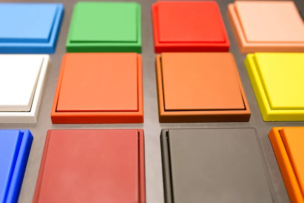 Multi-colored electrical switches on the plastic surface