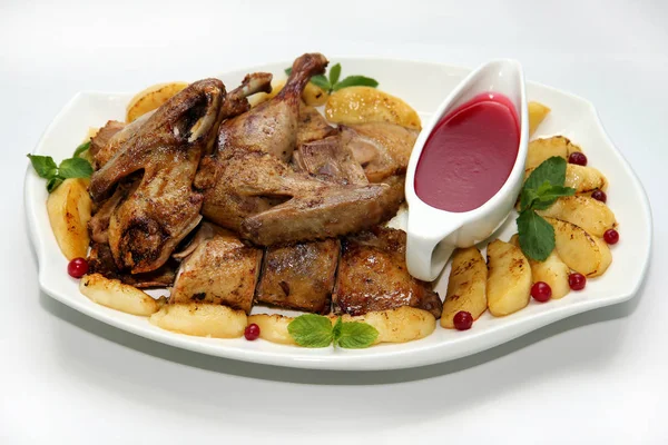 Roast duck with apples and cranberry sauce